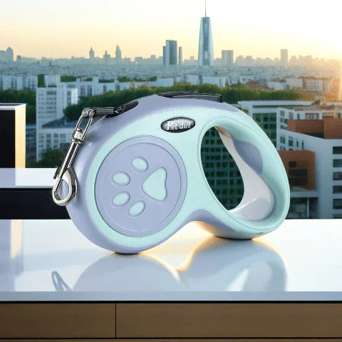 laisse enrouleur pattes de chien verte